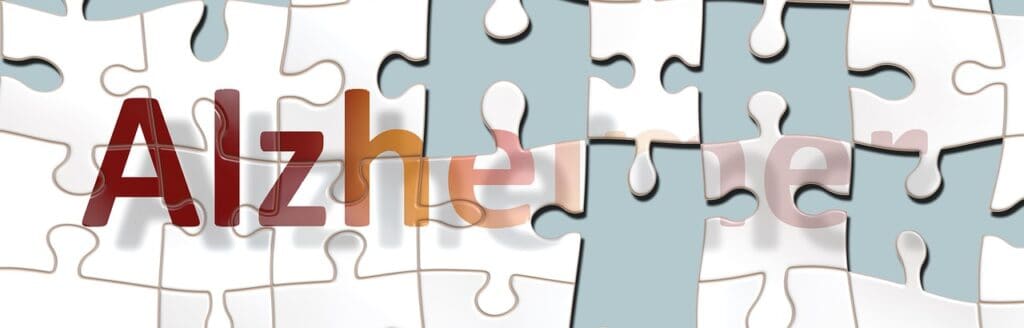 Puzzle that says "Alzheimer" with  missing pieces suggesting lost memory and cognitive function
